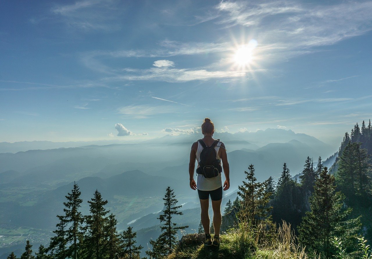 hiker, standing, woman, top, journey, adventure, backpack, hiking, mountain, tourist, activity, trekking, trek, peak, female, landscape, outdoor, cliff, backpacker, sky, mountain top, satisfaction, nature, endurance, traveler, blue sky, blue travel, blue landscape, blue mountain